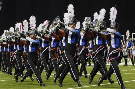 Dci drum corps - Group Tickets (20+) $25 - $60. Scholastic Groups of 20 or more receive a $5 discount per ticket in the Super Premium and Premium sections. A $10 discount per ticket is available in the Super sections. Sale prices do not include $2.95 non-refundable processing fee per ticket. 